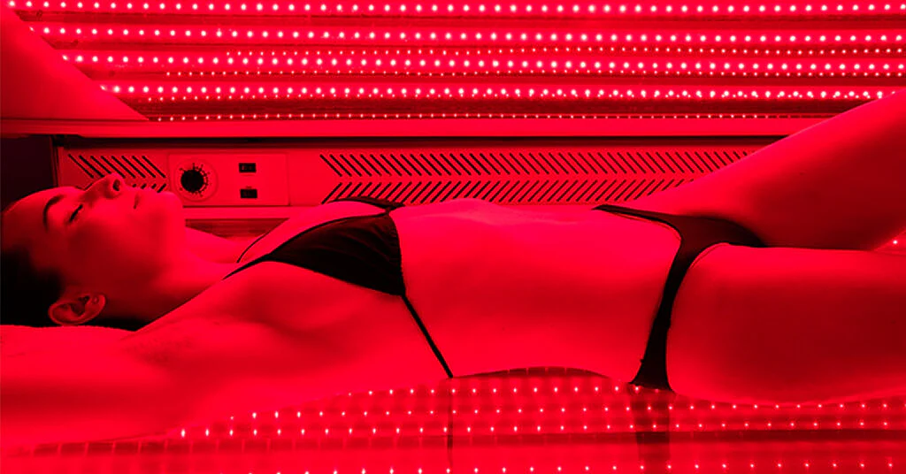 Red light Pro-Bed step 02 - During Treatment Woman relaxing during full-body red light therapy Pro-Bed session at REDSOL Wellness Club League City TX